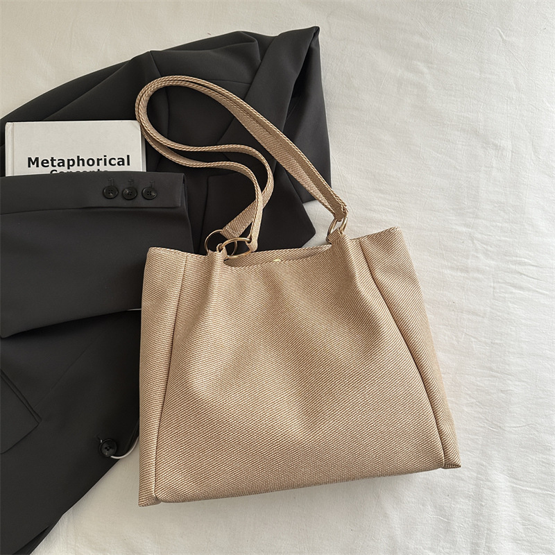 Bolsa de textura para mujeres de gran capacidad 2025 nueva primavera y verano ocio rayas bolsas de compras de hombro para clase de viaje bolsa