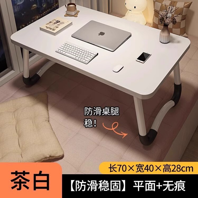 折り畳み可能なベッドの上の小さなテーブルは机のノートパソコンのテーブルを勉強します。|undefined