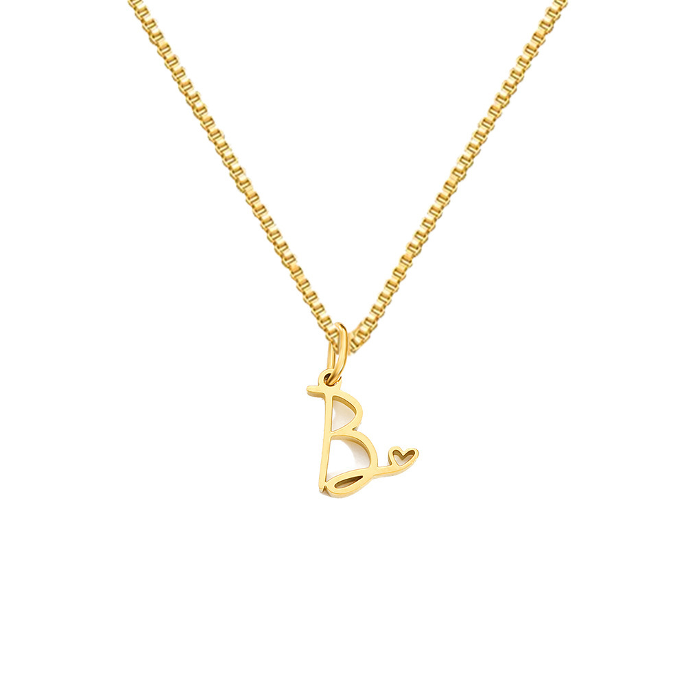 Collier en acier titane style INS 26 avec pendentif cœur et lettre, design intemporel, pour femme. Bijou inaltérable._voghion.com