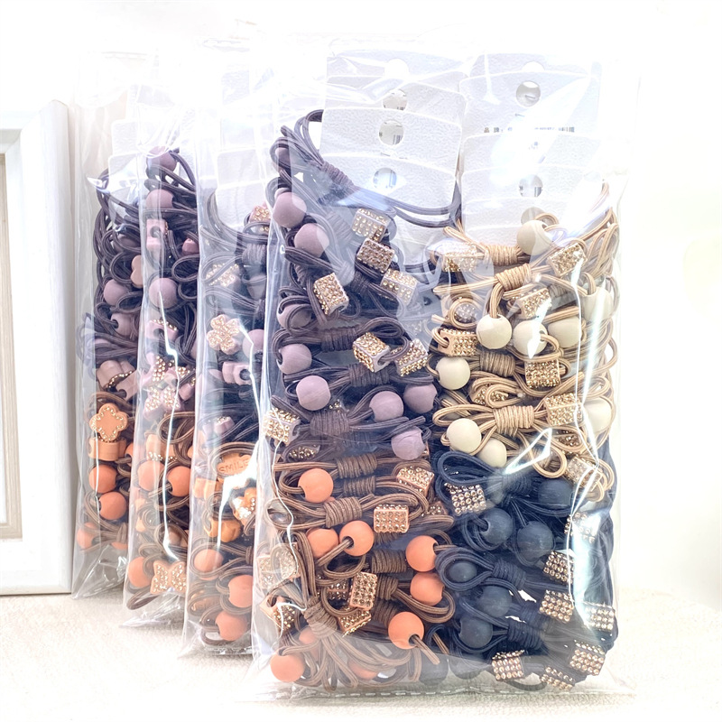 20 estilo coreano de dibujos animados lindo té de leche Tarjeta de color Banda de pelo banda de goma de color de primavera tienda física supermercado 2 yuanes tienda al por mayor