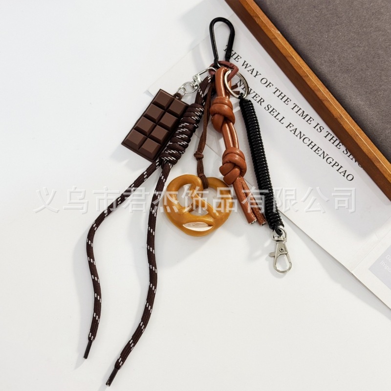 編みカバンのストラップの螺旋の結び紐のiuは鍵のボタンのネットの赤い色の結びの縄の装飾の部品を結びます。