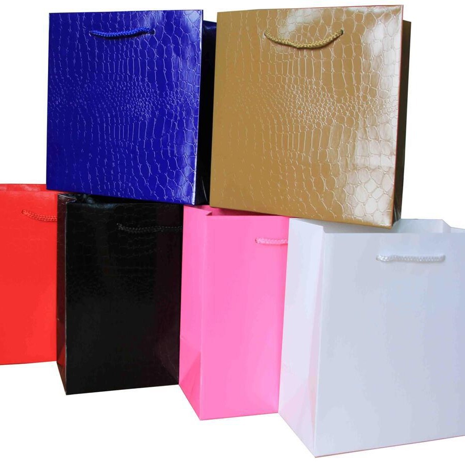 服装购物牛皮纸袋批发白卡压纹袋包装礼品手提纸袋 浮雕亮面袋子