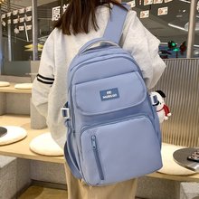 新款韩系纯色双肩包时尚简约风挂件学生书包大容量中高男女学生包