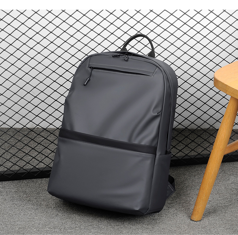 A new minimalist backpack for men, a Korean-style casual and fashionable backpack for laptops, with a logo printed on it undefined