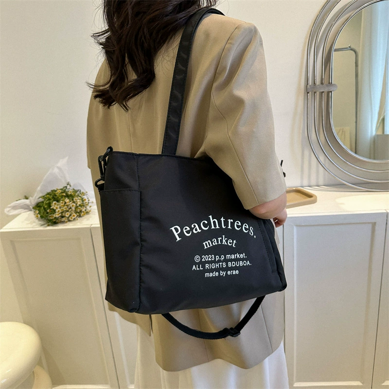 Fashionable retro one-shoulder city bag with increased thickness, available in black, white, and dark khaki