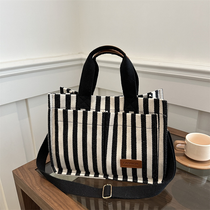 Bolsas de gran capacidad de transporte 2024 nuevas bolsas de mujer populares bolsas de lona a rayas bolsas de mochilas de moda bolsas de mano