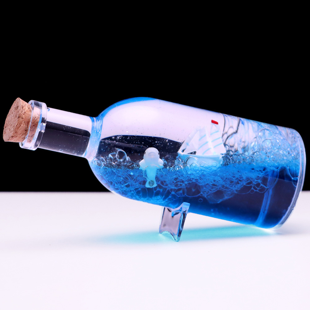 Botella a la deriva montando el viento y rompiendo las olas Botella de vela Perla Negra reloj de arena gotas de aceite Regalo de Cumpleaños descompresión decoración de escritorio al por mayor