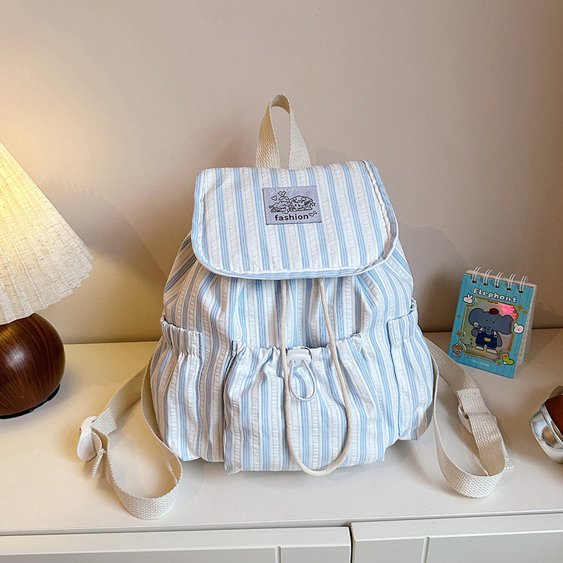 Bolsa de lona a rayas casuales de viento universitario para mujeres verano 2026 nueva mochila simple de gran capacidad mochila de estudiantes