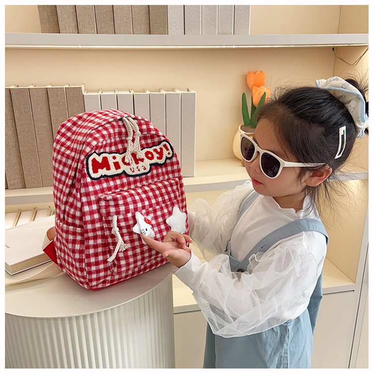 The large-capacity red woolen checkered backpack for primary and secondary school students is a unique and versatile choice. It's a trend for girls to carry backpacks during their leisure trips undefined