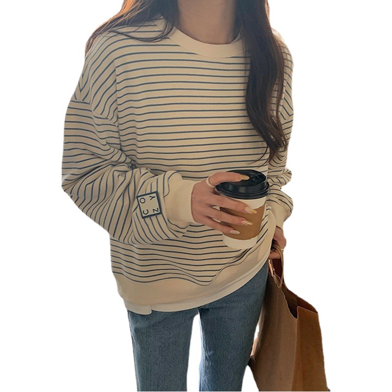 Selección estricta manga fuera del hombro suéter de manga larga a rayas diseño de nicho de las mujeres adelgazamiento Oversize primavera y verano transfronterizo Top Moda