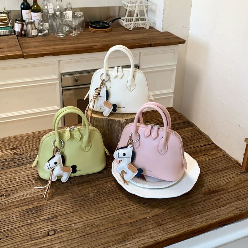 Bolsa de bolos transfronterizos de mujer conchas de bolso de diseño de mujer 2026 bolso diario de nicho de moda bolso de hombro image 1