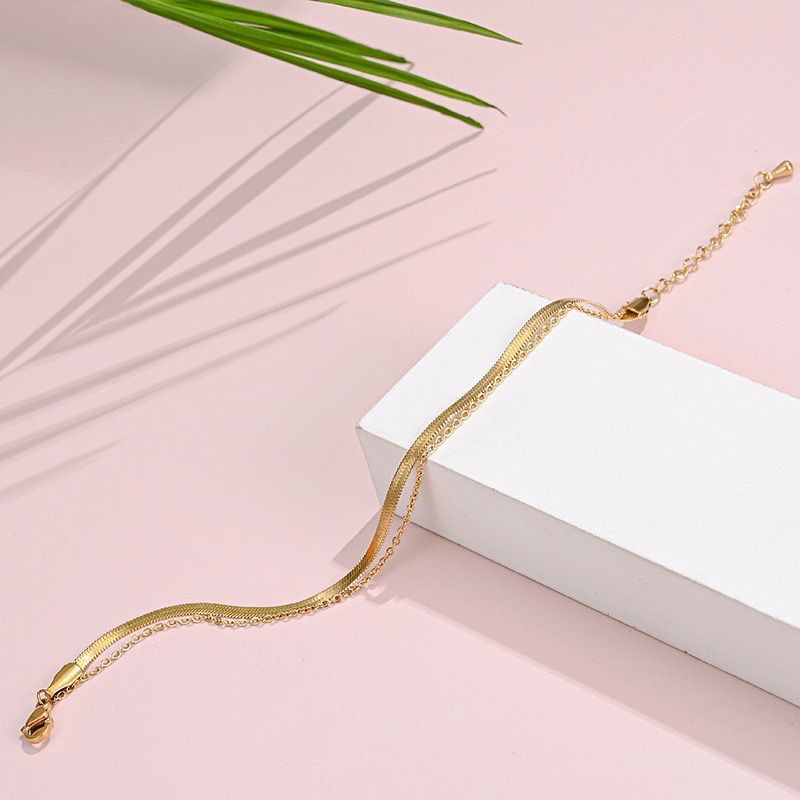 Diseño de nicho de estilo coreano ins Cadena de hueso de serpiente plana simple cadena de hoja de acero de titanio de todo fósforo tobillera personalidad mano de alto grado