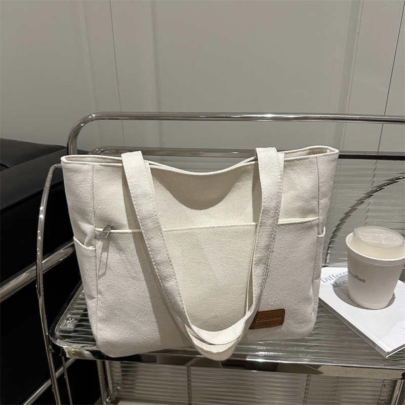 Bolsa de lona de alta capacidad para mujeres japonesas simple versátil bolso de hombro de viaje de estudiantes bolso especial