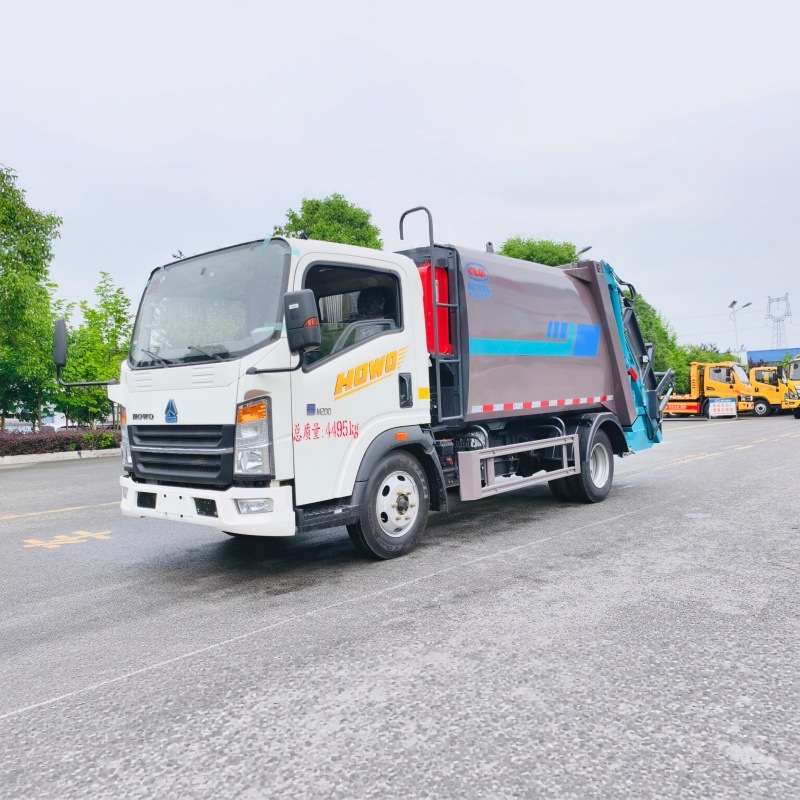 Howo pure electric rear-mounted compressed garbage truck with independent sewage collection for municipal solid waste compaction and removal