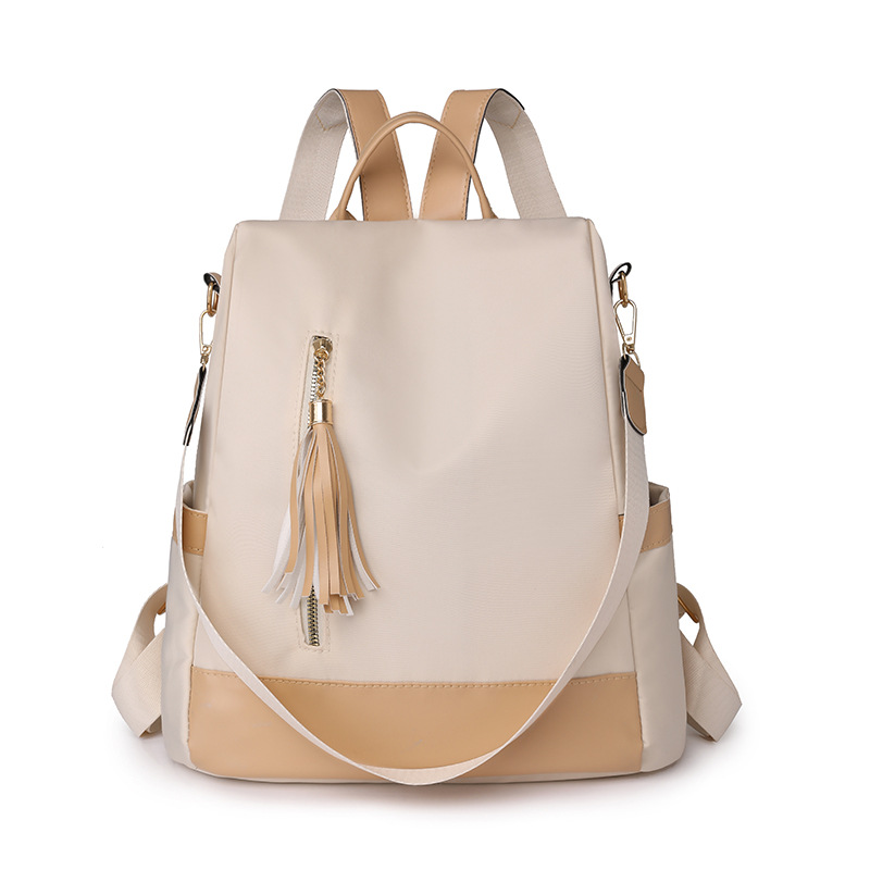 2024 nueva mochila de color de contraste moda simple mochila casual mujer cuero suave bolsa de viaje ligera de gran capacidad al por mayor