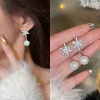 Earrings from pearl, with snowflakes