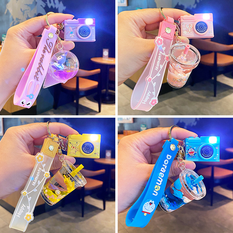 Oil flowing sand bottle star Delu keychain female exquisite cute Jingdang cat schoolbag pendant car key chain wholesale