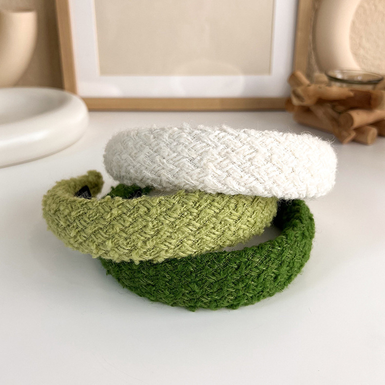 韓国の秋冬の編み物の高い頭の頂の広い辺のカチューシャの女性の外出の百合の髪の気質の毛のカチューシャの頭の飾り