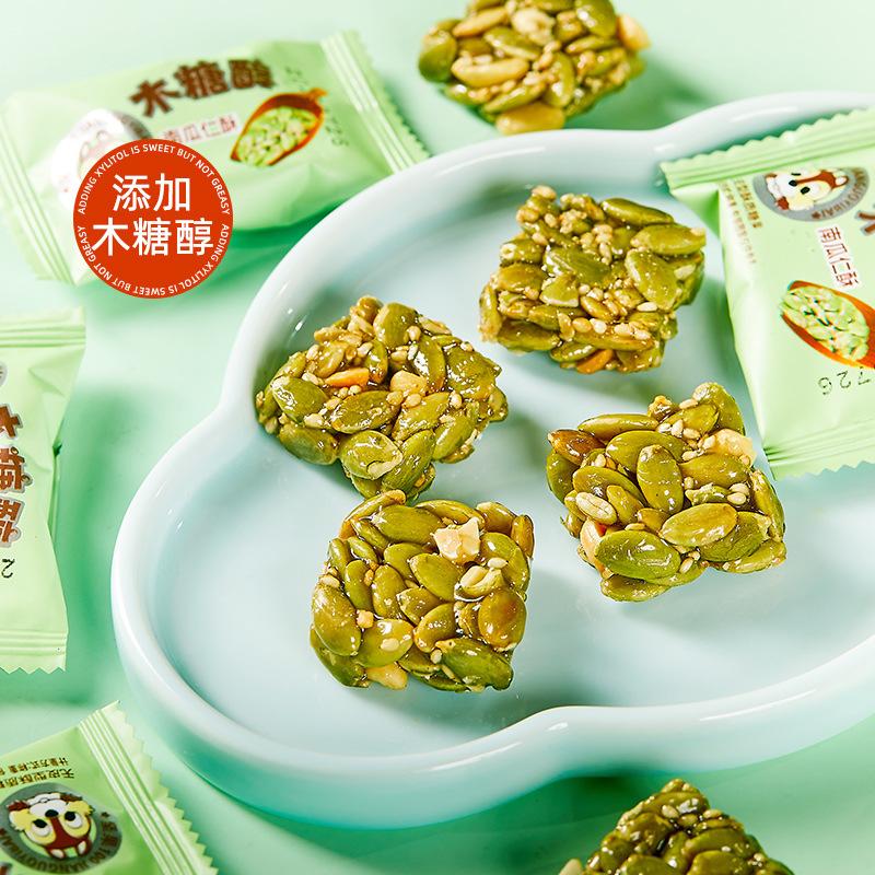 Sugar-free pumpkin seed, peanut, and sesame snacks in individual packaging, office leisure snacks