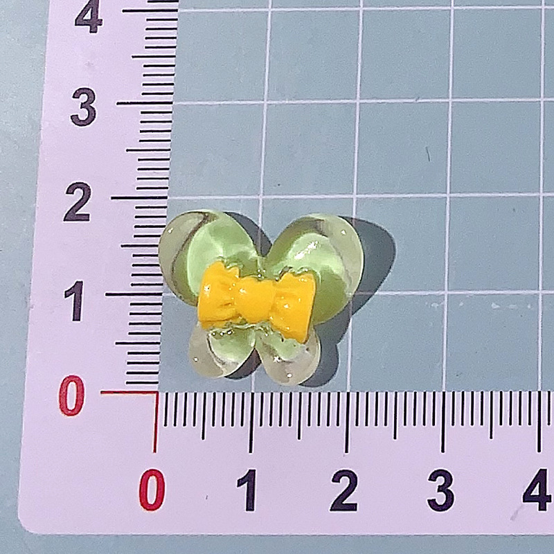 Nuevo color transparente mariposa arco DIY accesorios de resina pegamento crema caja de teléfono móvil adornamiento de pelo agujero material de parche de zapatos agujero