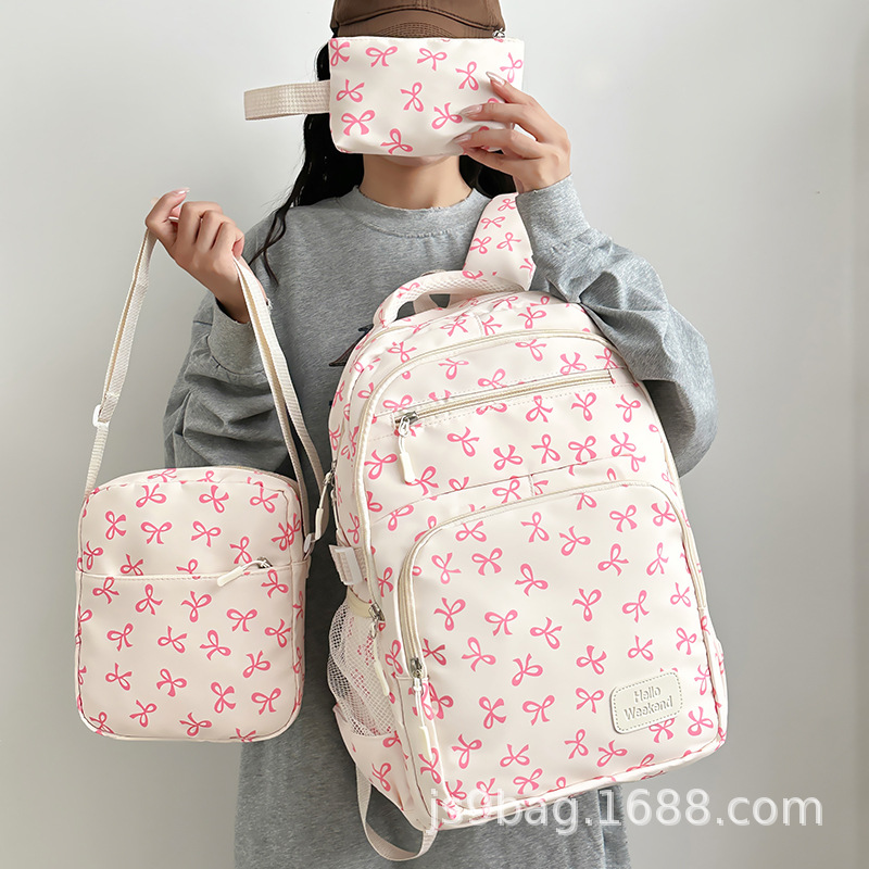 跨境三件套书包女孩大学生双肩包大容量蝴蝶结满印花旅游轻便背包
