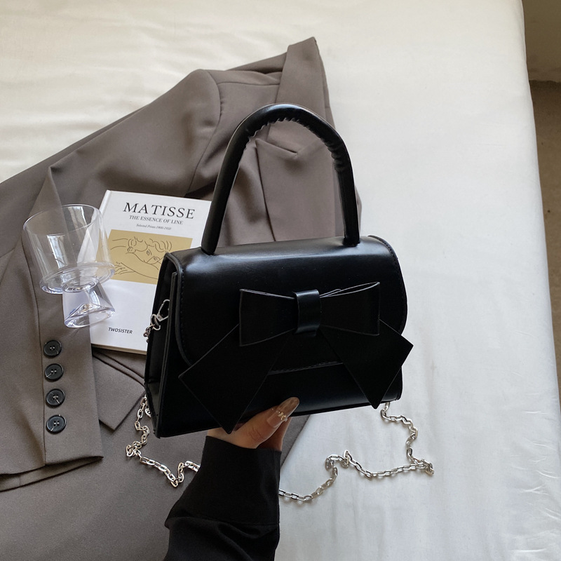 Bolso de mujer 2025 tendencia de verano nueva moda dulce arco de hombro bolso de mano bolso de mano