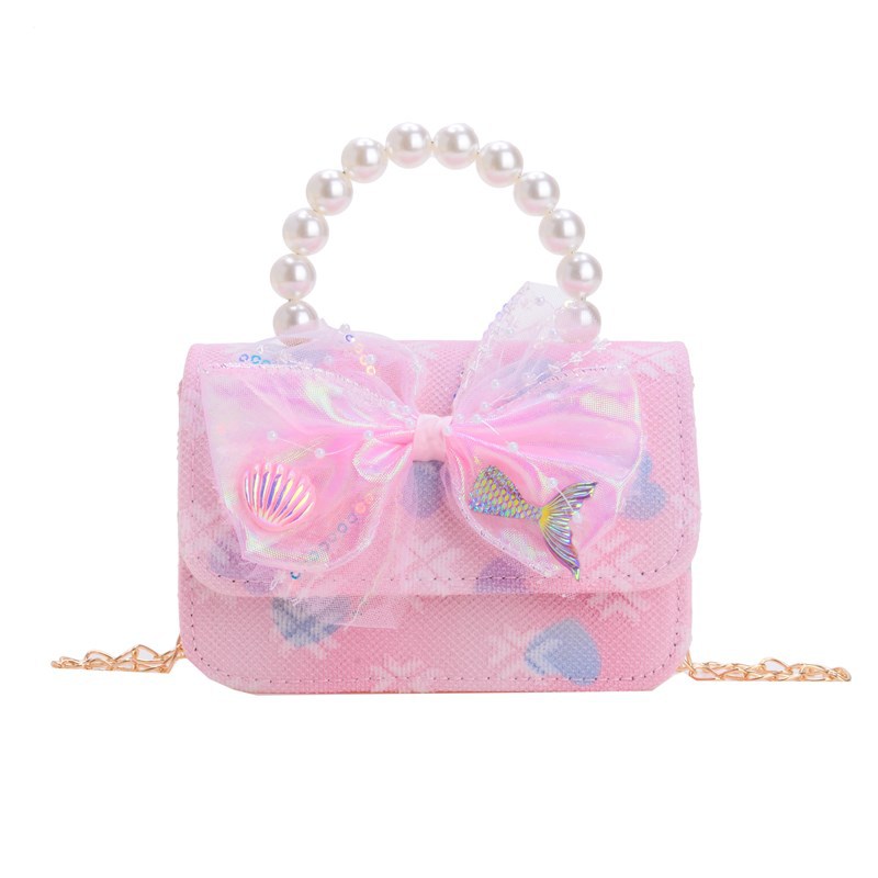 Nuevo bolso infantil dulce lindo arco bebé bolso de perla cadena de moda bolso de hombro para hombres y mujeres