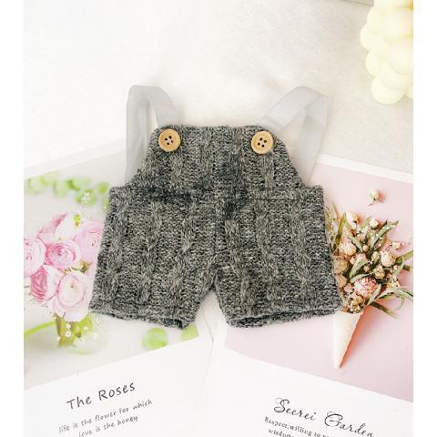 Gray overalls (long in front, short in back)