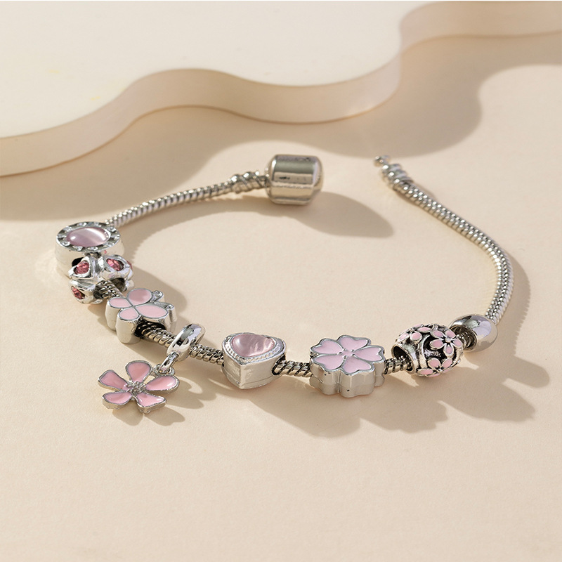 Panjia pulsera Dora DIY cuentas explosivas transfronterizas colgante pétalos de goteo de aceite ajustable flor amor pulsera de cobre