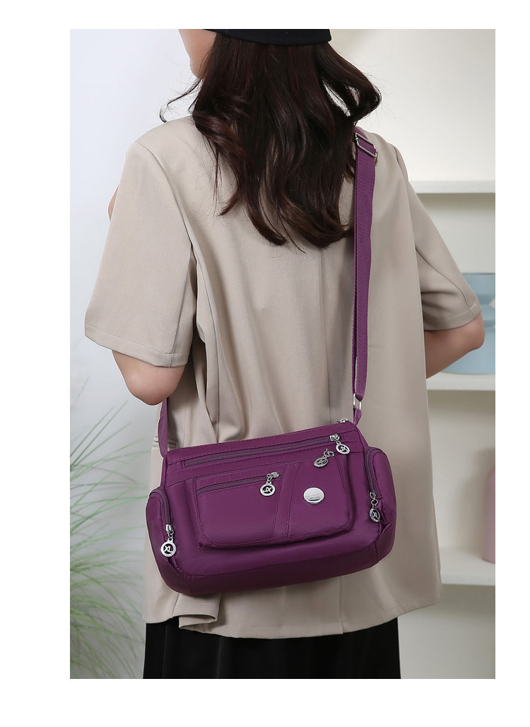 A new popular women's crossbody bag with multiple layers made of Oxford fabric, fashionable, casual and trendy. It's a single-shoulder bag for middle-aged and elderly mothers undefined