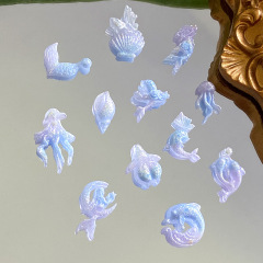 青い海洋シリーズのネイルアクセサリー夜光樹脂ネイルアクセサリーマーメイドイルカクラゲネイル素材