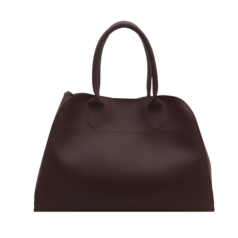 Europa y los Estados Unidos de moda retro sensación extranjera de gran capacidad bolso de cubo portátil de mujer 2025 primavera nueva moda simple bolso de tote