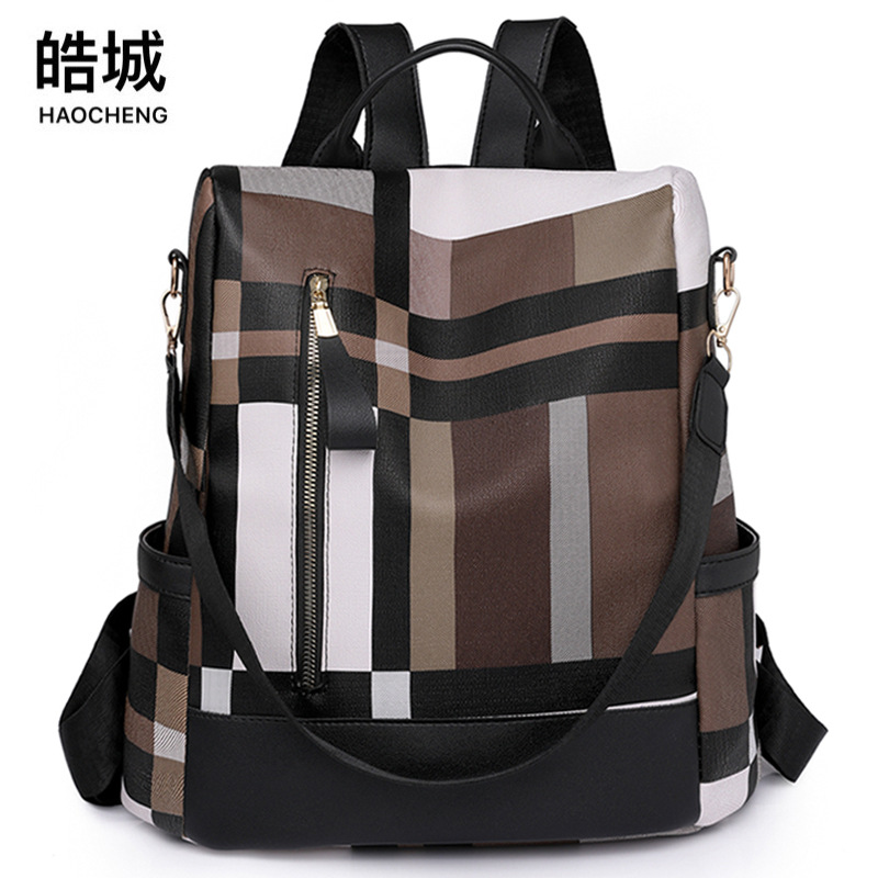 Mochila antirrobo para mujer 2023 nuevo estilo cuero suave moda contraste color multifuncional al aire libre mochila de viaje ligera al por mayor