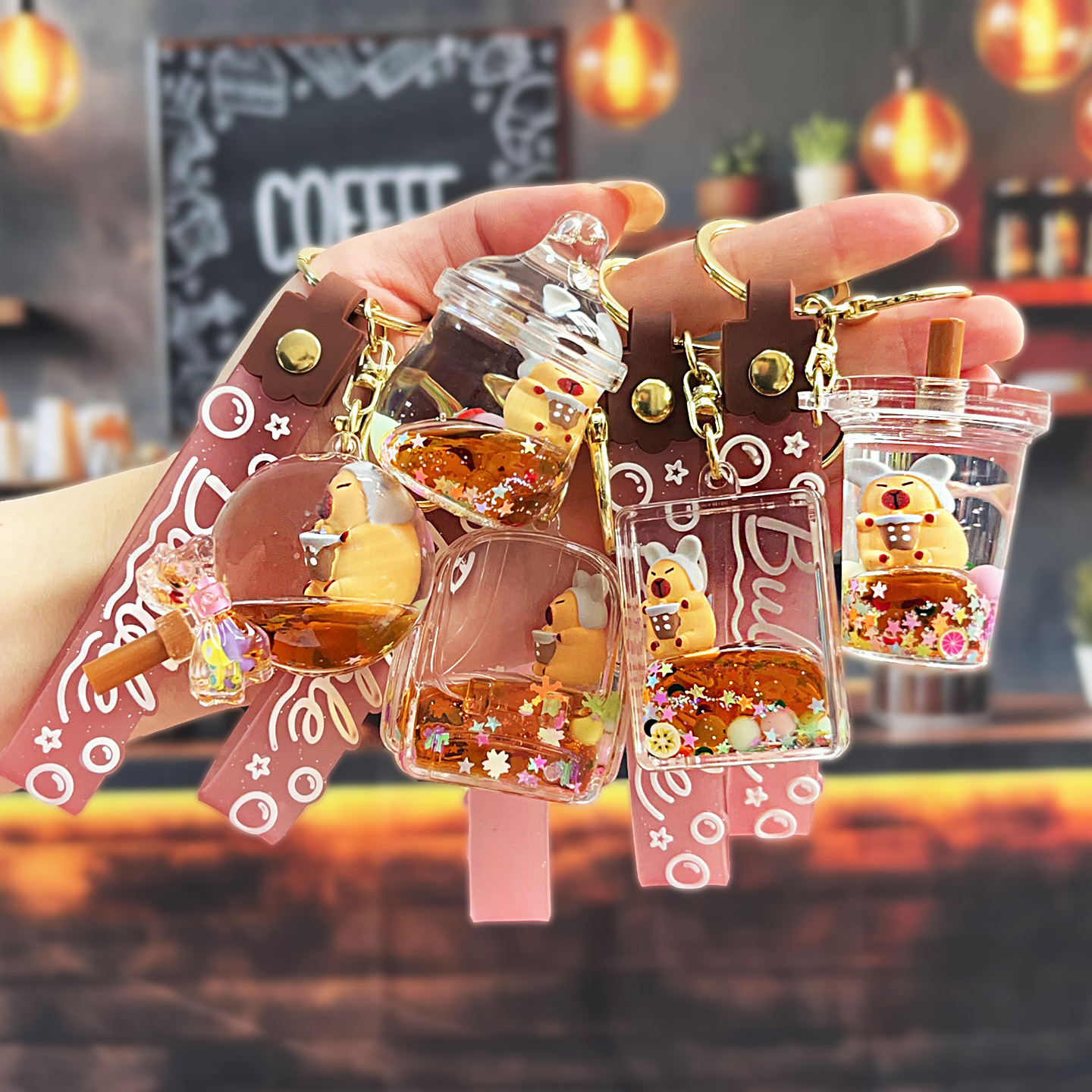 Nuevo aceitoso arena movediza taza de té con leche llavero colgante lindo divertido Kapibala llavero flotante pequeño regalo al por mayor