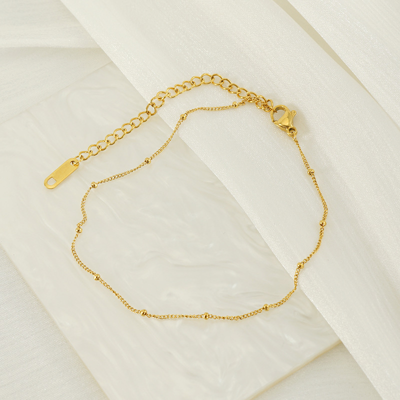 Transfronterizos Europa y América simple cinturón de perlas lateral cadena de pie pie de acero inoxidable chapado en oro 18K universal acero de titanio tobillas de mujer