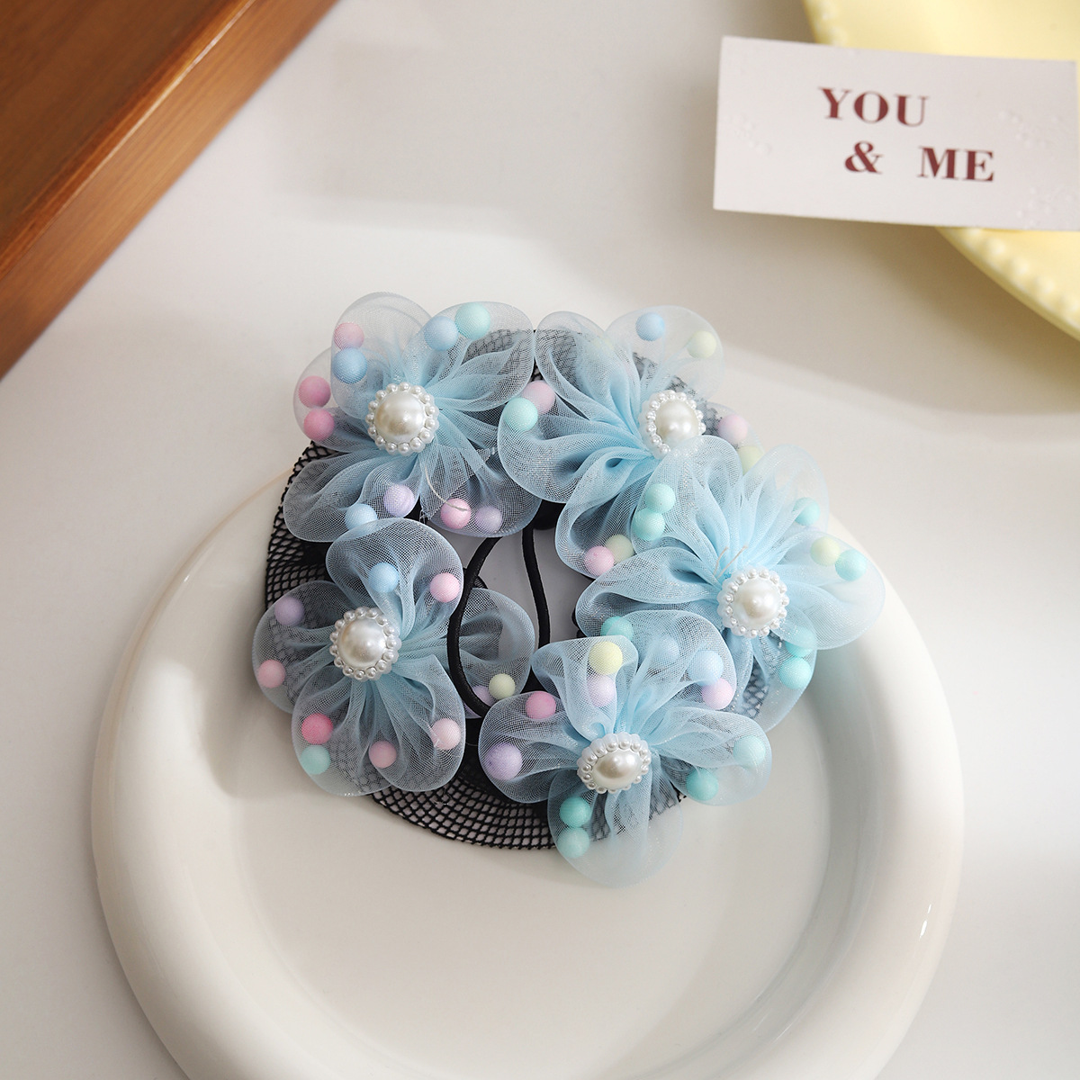 Redecilla para moño de niña con accesorio de flor_voghion.com