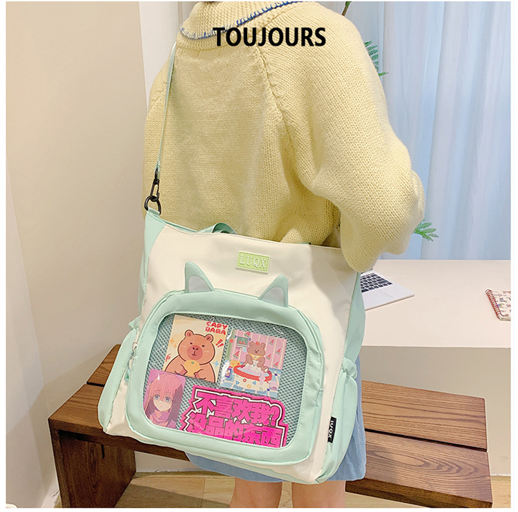 The new cute cartoon printed student bag with a large capacity and transparent student storage single-shoulder bag is selling well for women undefined