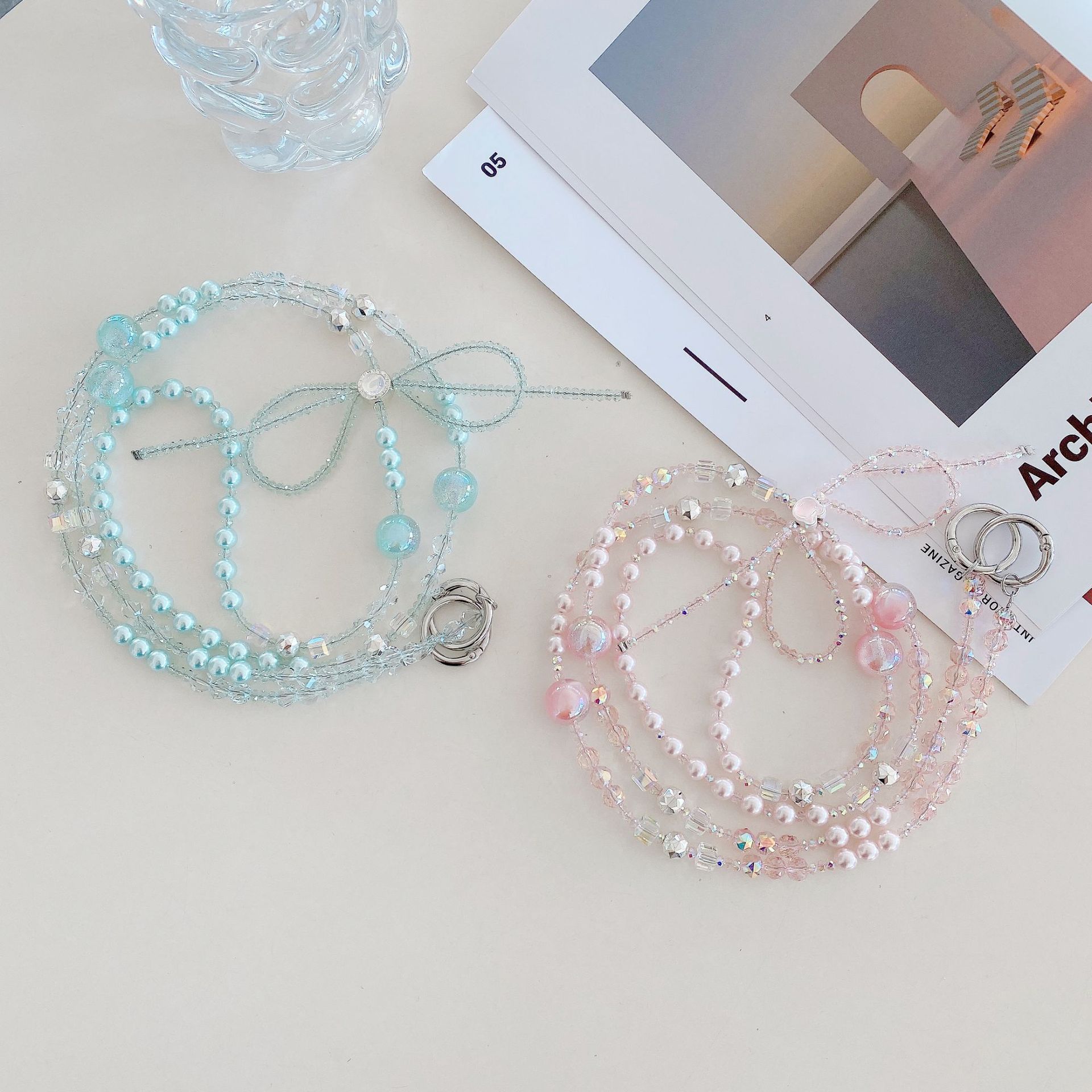 Boutique hecho a mano cadena colgante de alta gama arco fresco de cuatro colores cadena larga cordón de teléfono móvil de moda mensajero largo/colgante