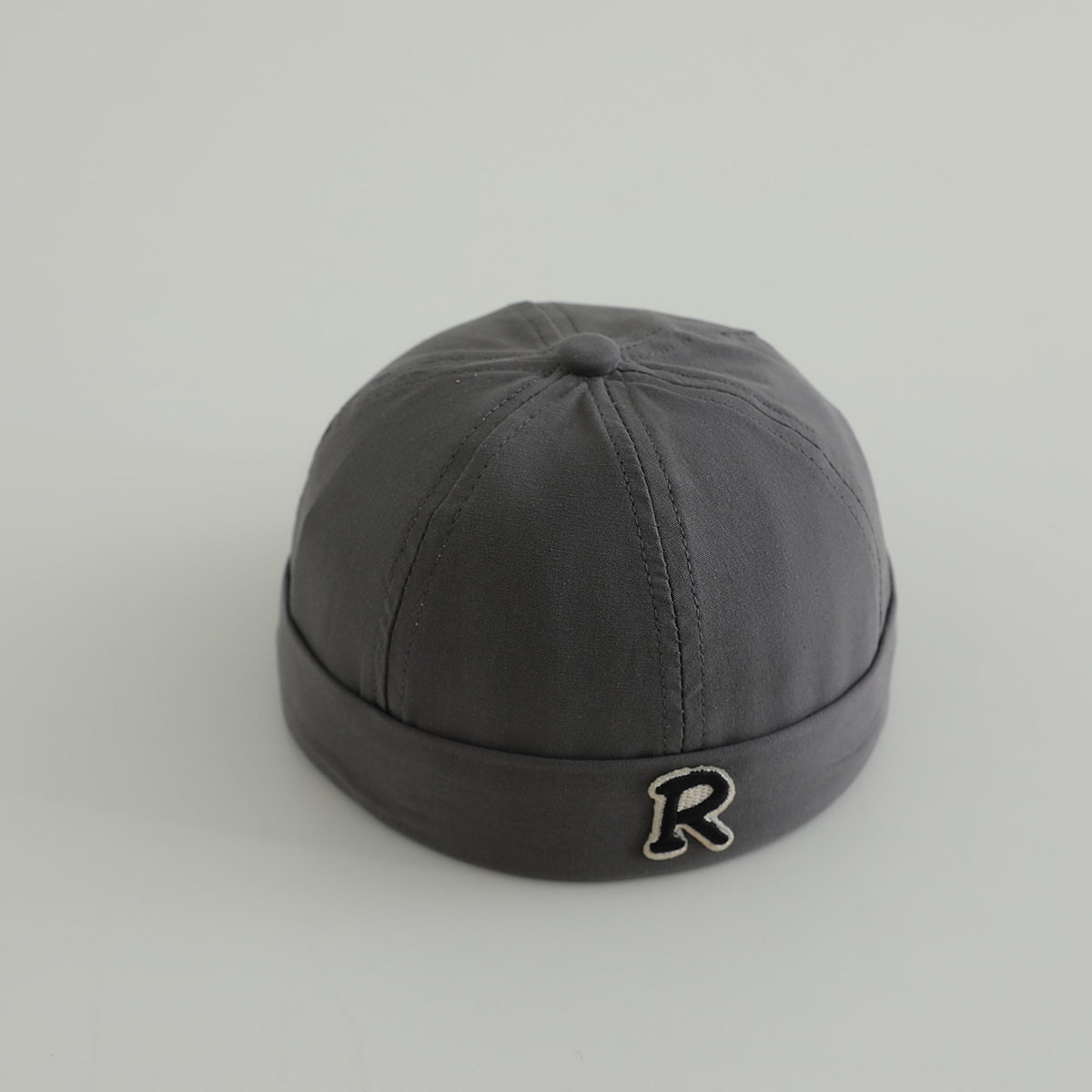 Primavera niños terratenientes sombreros hombres y mujeres letras de la marea sin bordes sombreros de piel de melón sombreros de calabaza sombreros de boina de personalidad