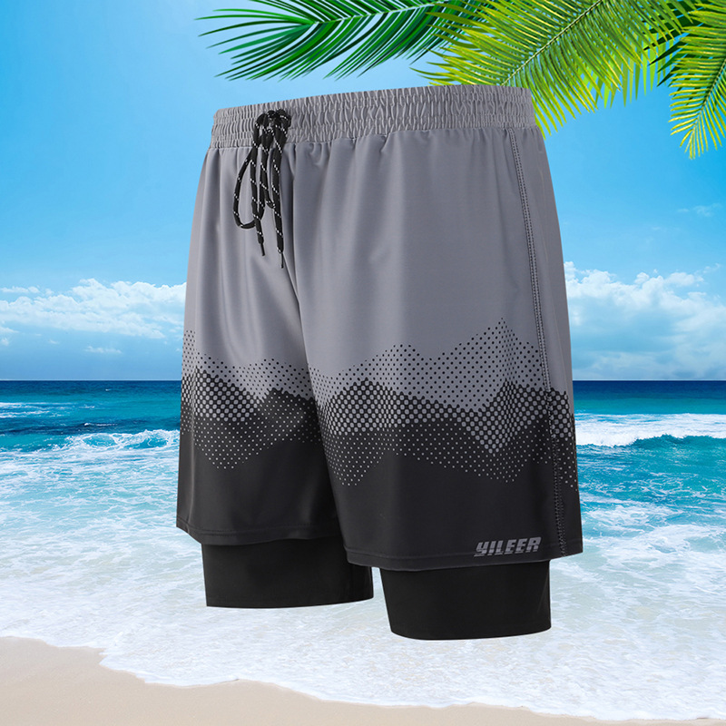 Trajes de baño de primavera 2025 al por mayor para hombre, anti-embarrassment, de doble capa, sueltos, de playa, de cinco puntos.