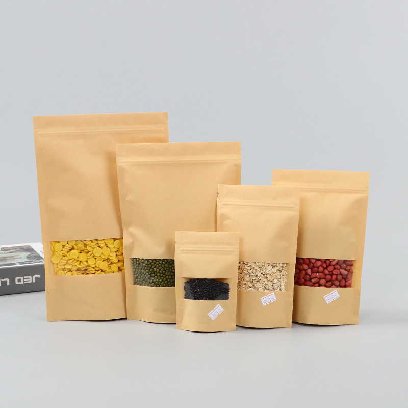 Spot bolsa de papel kraft con ventana transparente bolsa de embalaje de alimentos autosellada autoportante bolsa de té sellada de ocho lados fácil de rasgar