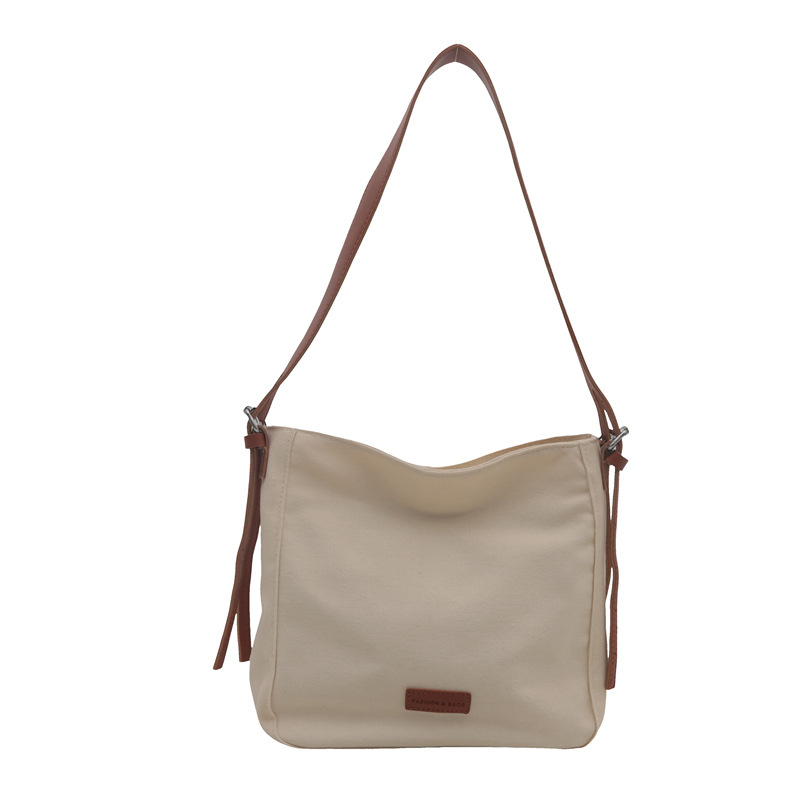 Bolso bandolera de lona de moda para mujer 2024 marea de otoño nuevo estilo de gran capacidad de costura de color de contraste viaje a clase bolso de viaje