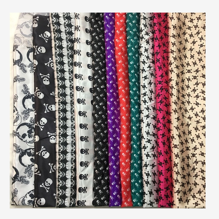 现货直销色丁印花面料 万圣节装饰服装布料 骷髅头仿真丝印花面