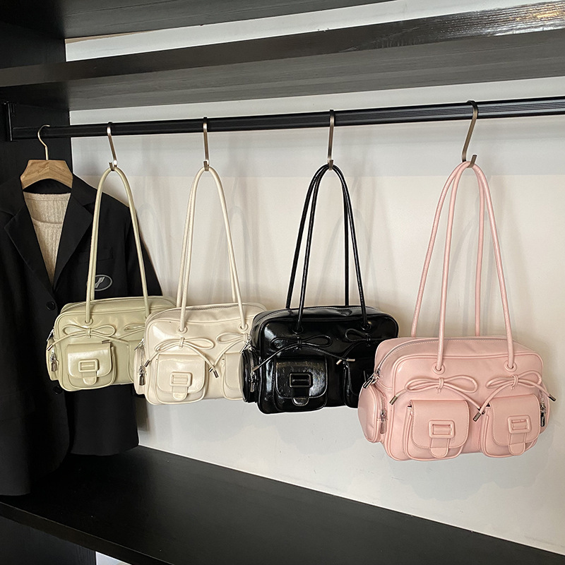 Bolsa de brazo coreana de arco de gran capacidad de moda extranjera bolso de hombro de viaje diario bolso de nicho de diseño