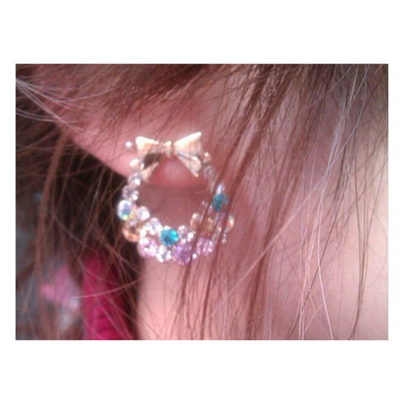 Versión coreana del color diamante arco pendientes Taobao pendientes joyería 9 yuanes tienda de suministro