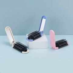 多色の長い条の折り畳みのエアクッションの櫛の旅行の美髪は化粧を直します。