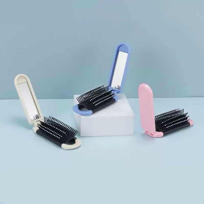 多色の長い条の折り畳みのエアクッションの櫛の旅行の美髪は化粧を直します。|undefined