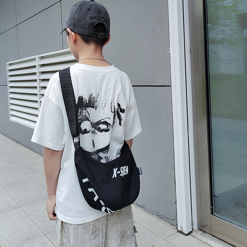 Moda coreana de moda para niños y niñas bolsas de饺os letras de aire extranjero de gran capacidad bolsas de mochila para niños nuevas bolsas para niños