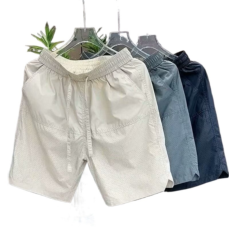 Pantalones cortos casuales de color sólido verano nuevo estilo delgado perforado transpirable pantalones de cinco puntos pantalones sueltos casuales de cinco puntos