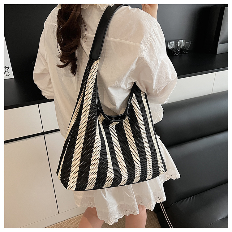 Korean summer new striped woven bag, casual vacation and laid-back style tote bag, hand and shoulder commuter tote bag undefined